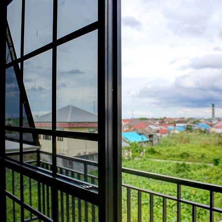 Oyo 90162 Remboelan Guest House Sungai Lutus ภายนอก รูปภาพ