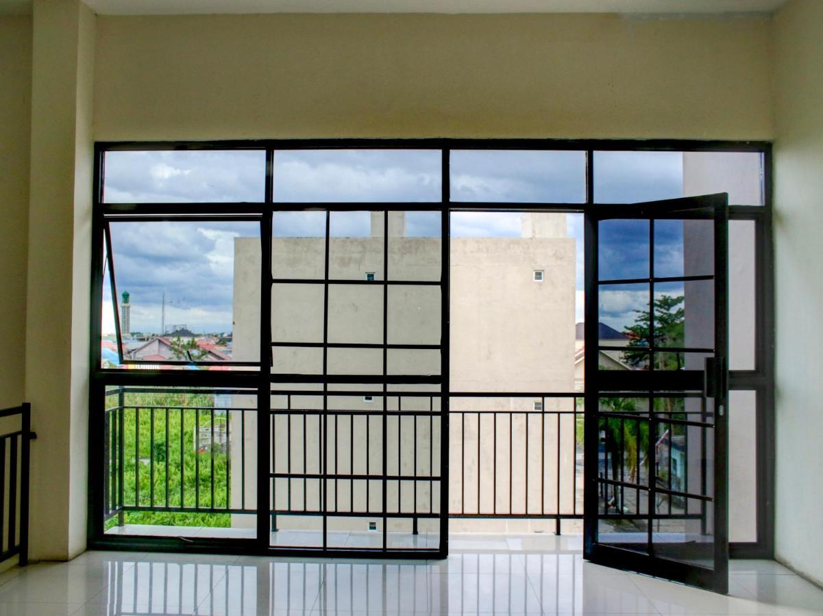 Oyo 90162 Remboelan Guest House Sungai Lutus ภายนอก รูปภาพ