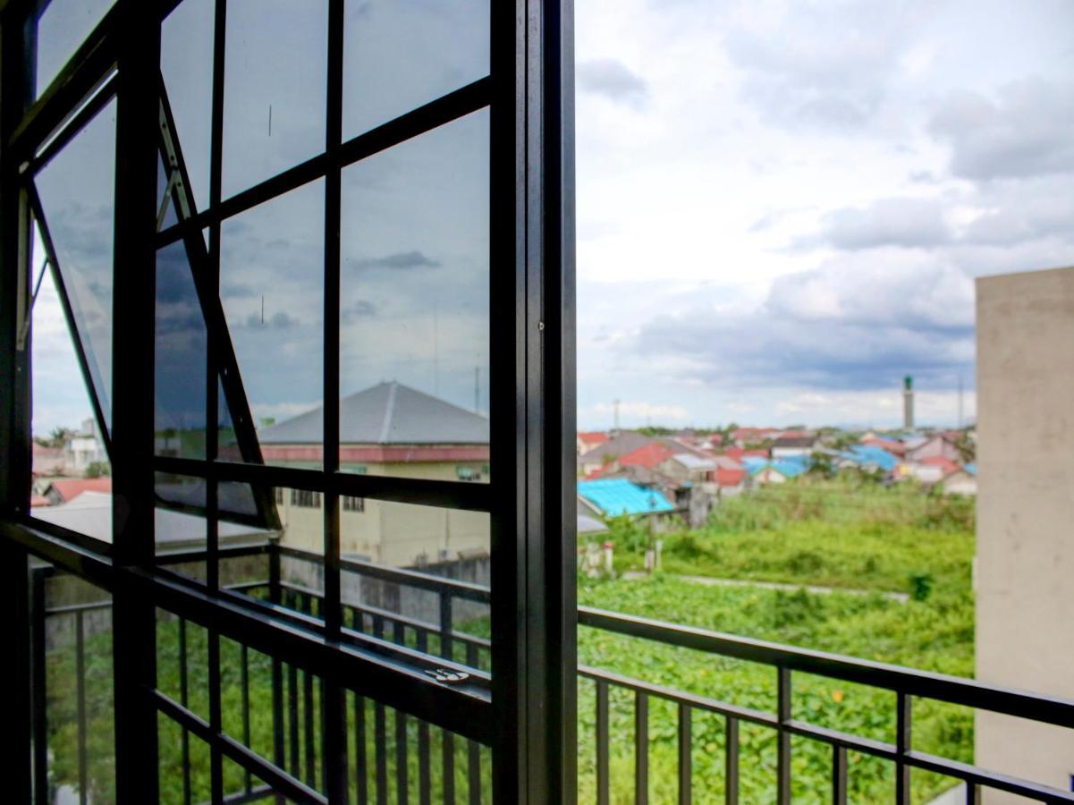 Oyo 90162 Remboelan Guest House Sungai Lutus ภายนอก รูปภาพ